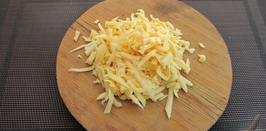 Фото приготовления рецепта: Кабачки, фаршированные болгарским перцем с морковью и сыром - шаг №14