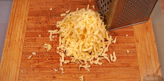 Фото приготовления рецепта: Артишоки, запечённые с сыром и сливками - шаг №8