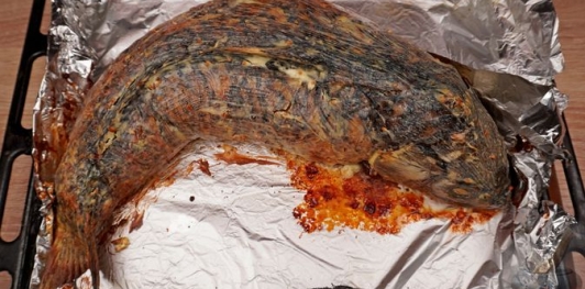 Фото приготовления рецепта: Карп, фаршированный грибами (в духовке) - шаг №24