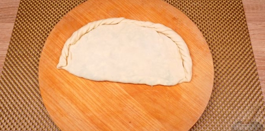 Фото приготовления рецепта: Пирожки-лепёшки со шпинатом и сыром (на сковороде) - шаг №24