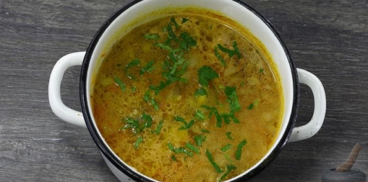 Фото приготовления рецепта: Суп с куриными сердечками и рисом - шаг №13